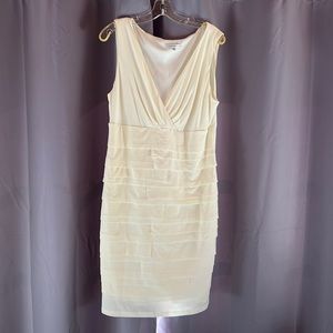 Cream cocktail dress worn once.  Lined and sleeveless.  39” in length